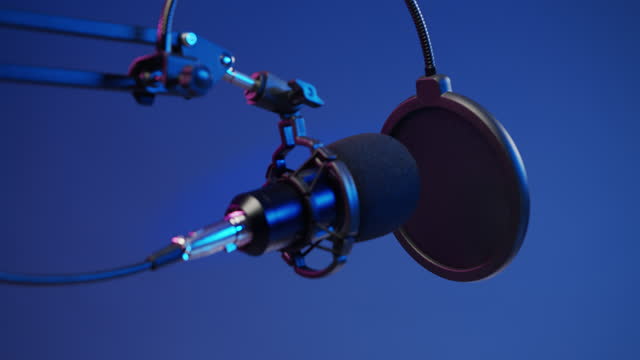 A professional microphone against the blu background in a studio light, shouted in 4k resolution